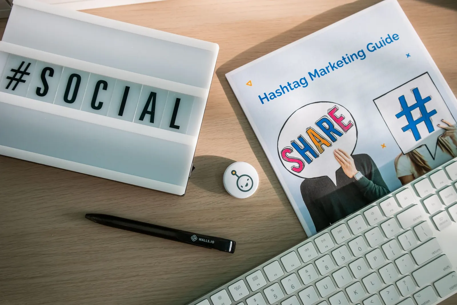 Desk flat lay with a SOCIAL lightbox sign